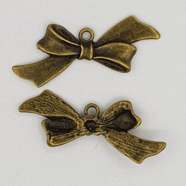 Breloque N&oelig;ud N&deg;18 breloque noeud papillon ruban en m&eacute;tal bronze