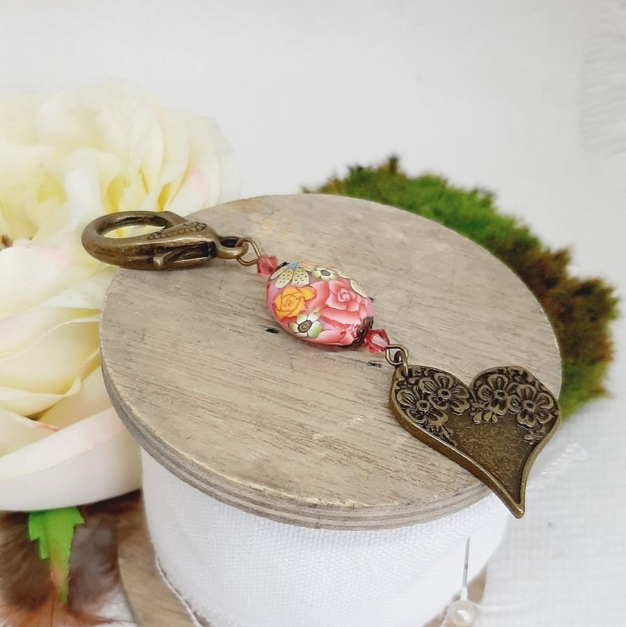 porte clé pendentif coeur bronze et magnifique perle en forme de lentille orginale