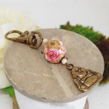 porte clés bouddha esprit zen et perle polymere fleurie aux couleurs esprit vintage 