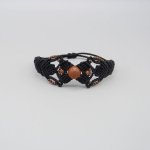 Bracelet en micro-macramé noir avec une perle centrale "pierre de soleil"