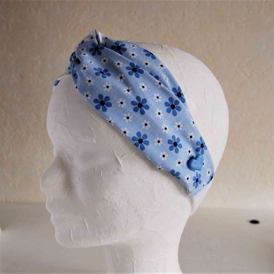Bandeau enfant coloris bleu avec boutons de chaque côté pour les masques