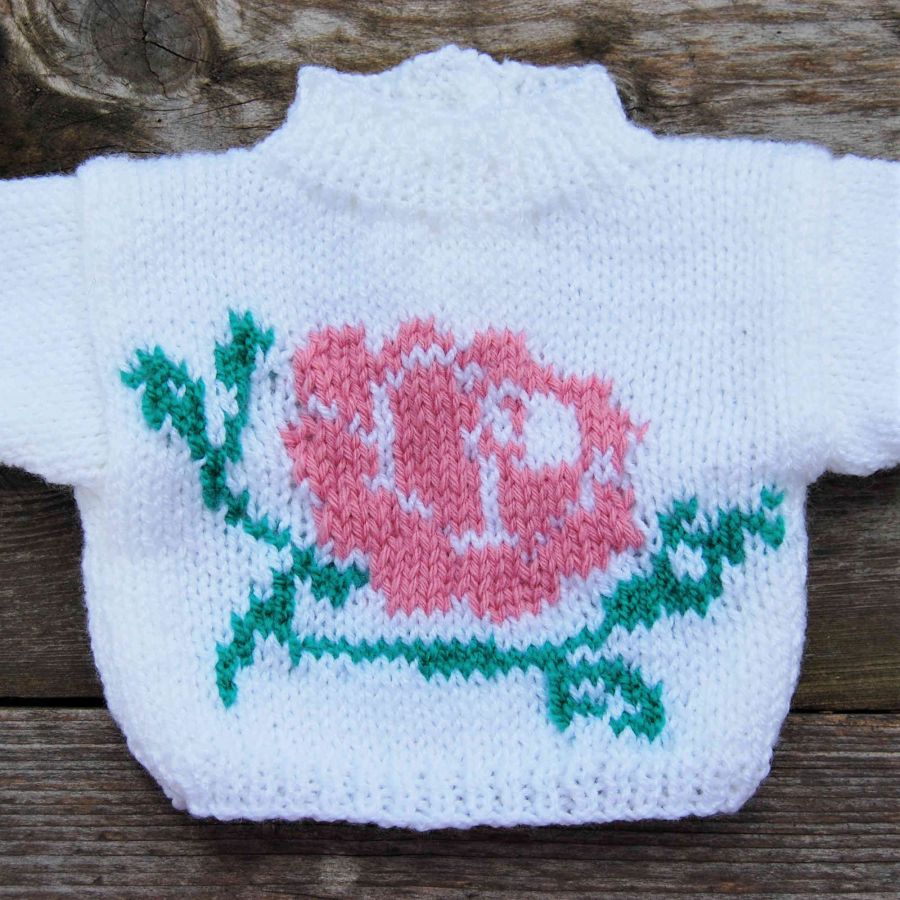 Pull poupée blanc avec motif rose fleurie
