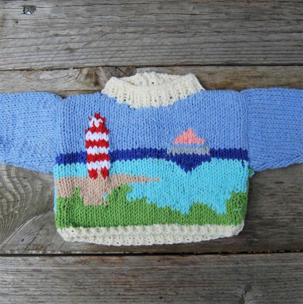 Pull poupée motif bord de mer