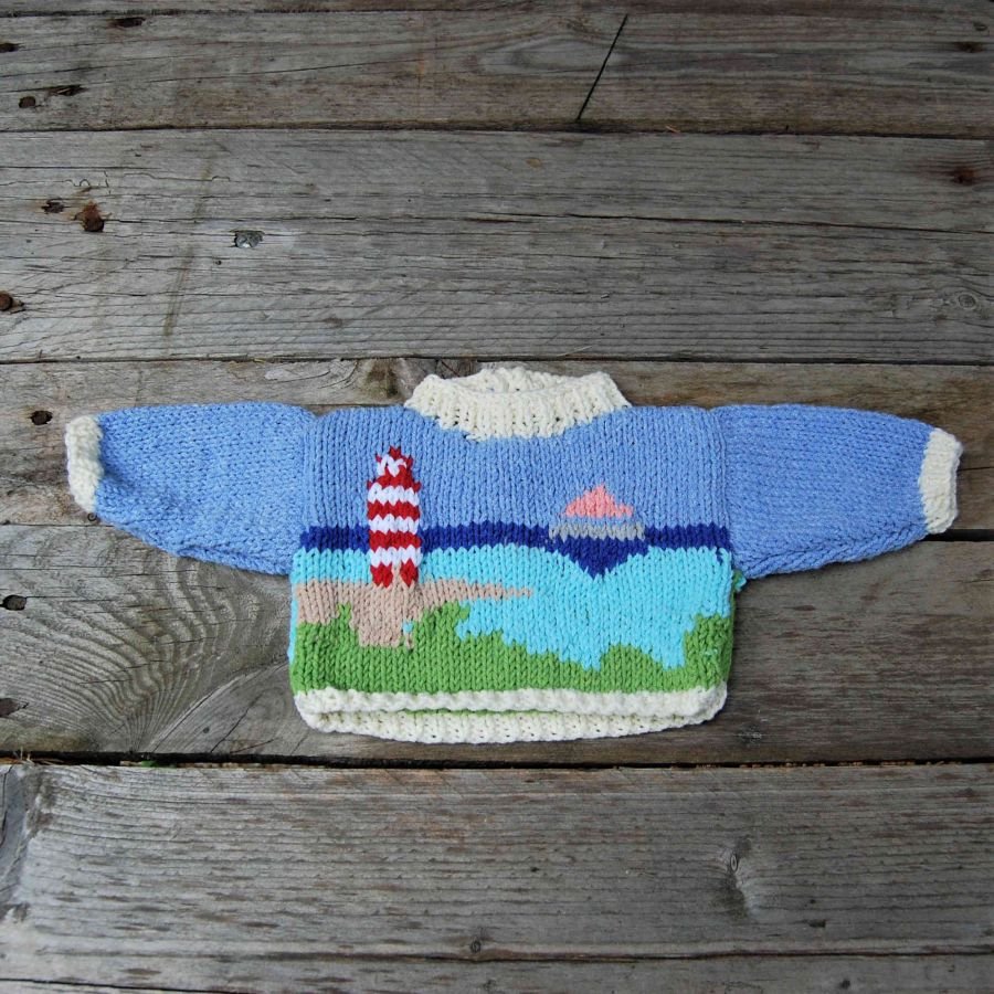 Pull poupée motif bord de mer